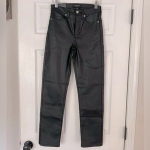 Brand-new, black coated jeans